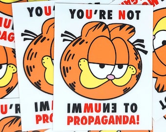 Propaganda Garfield Sticker – You're Not Immune to Propaganda Garfield decal – funny garfield stickers – anarchist progressive cat stickers