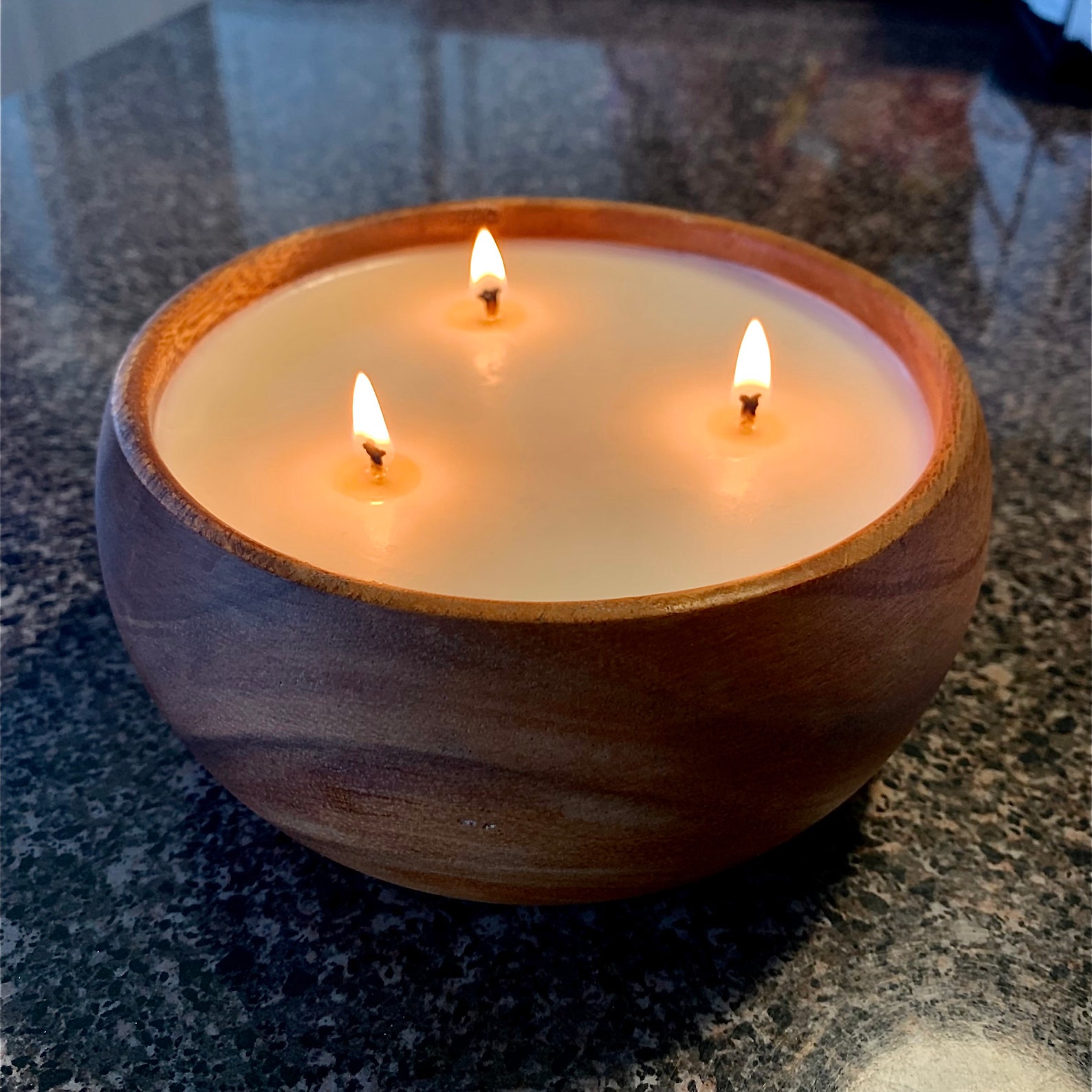 - Nature's Embrace: Candle In A Wooden Bowl For A Calming And Natural Touch