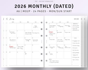 Könnte beinhalten: Eine datierte Monatsplanerseite für 2026, geöffnet für Januar, mit handschriftlichen Notizen und einer Prioritätenliste. Der Planer hat das Format A6 und umfasst 24 Seiten. Der Text "2026 MONTHLY (DATED)" ist sichtbar.