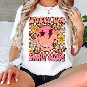 Worry Less| Smile More|Smiley Face| Butterflies| Daisies| Flowers| Checkered| Unisex| Women| T-Shirt| Tee.