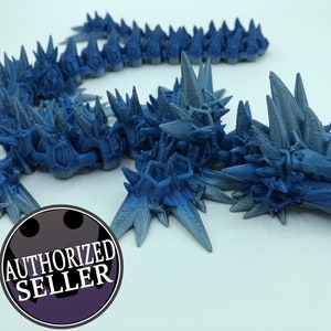 May include: A blue 3D printed dragon with a spiky, segmented body and a detailed head. The dragon is posed in a crawling position with its head raised.
