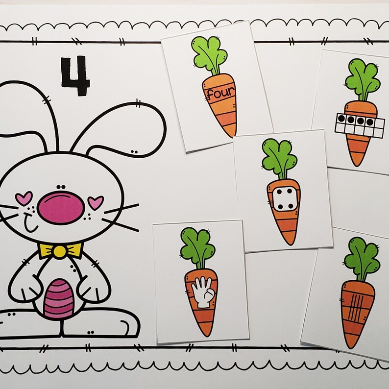 May include: A white bunny with pink cheeks and a yellow bow tie is holding a pink and white carrot. The number 4 is written above the bunny. There are five cards with carrots on them, each showing a different way to represent the number four: the word "four", four dots, a dice with four dots, a hand with four fingers, and four lines.