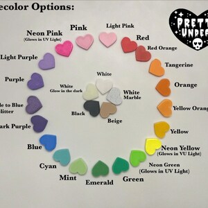 May include: A color chart showing various base color options for a product. The colors are arranged in a circle, with the names of each color listed below. Some colors are described as glowing in UV light.