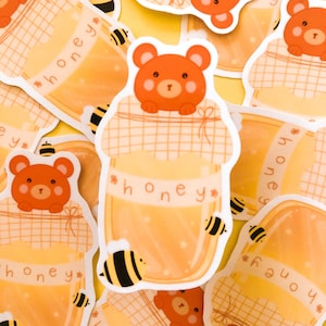 Sticker bourdon jaune en pot avec un ours en peluche