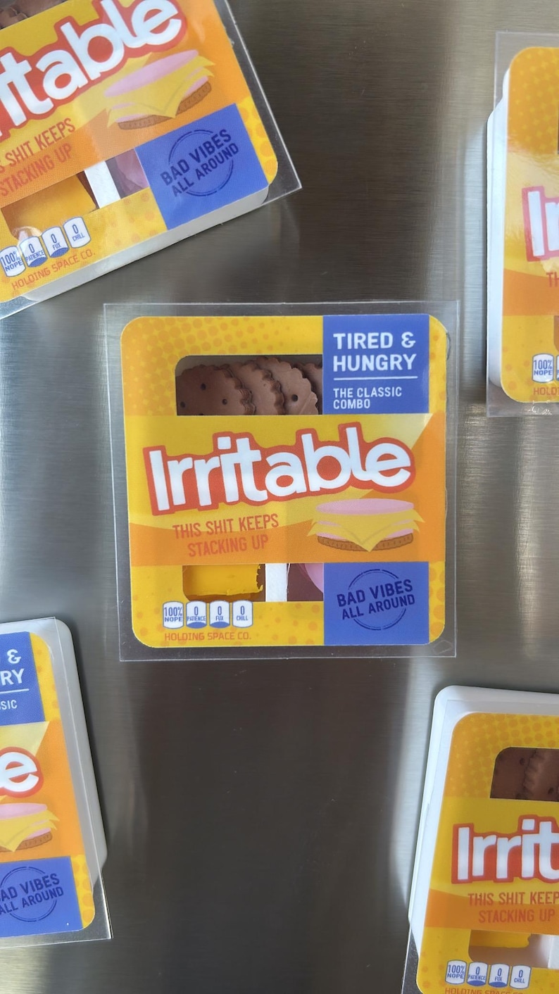 May include: Several packages of novelty food items with the word "Irritable" in large letters. The packages have a yellow and orange design with the text "Tired & Hungry" and "Bad Vibes All Around."