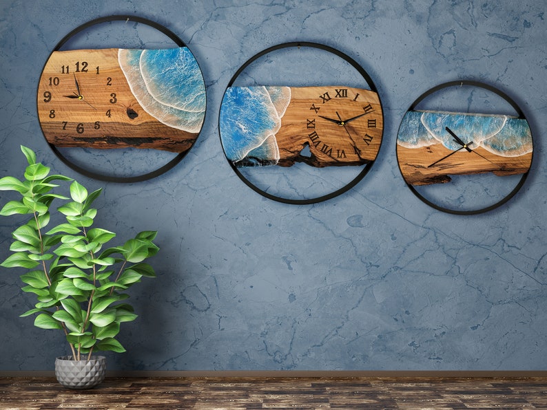 Olive wood and metal  wall clock
Close-up of resin ocean art on clock
Timeless Tides clock on a rustic wall
Customizable modern olive wood clock
Unique wall clock perfect for gifts