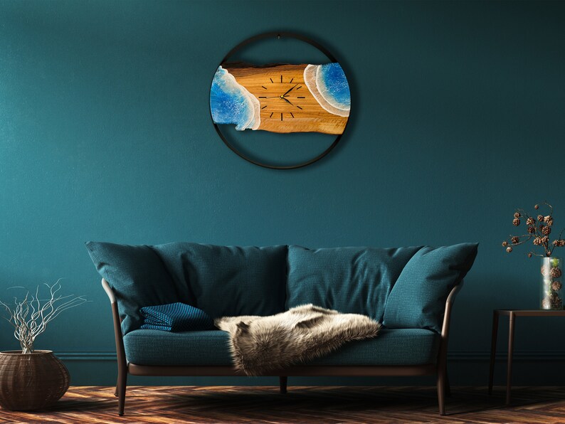 Olive wood and metal  wall clock
Close-up of resin ocean art on clock
Timeless Tides clock on a rustic wall
Customizable modern olive wood clock
Unique wall clock perfect for gifts