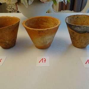 May include: Three terracotta pots with a rough, textured surface. The pots are labelled with the numbers 16, 17, and 18.