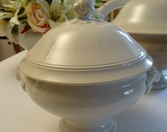 May include: White ceramic serving bowl with a lid and two handles. The lid has a decorative rosebud finial.