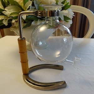 Old coffee maker, glass ball, vase, horseshoe, France, vintage