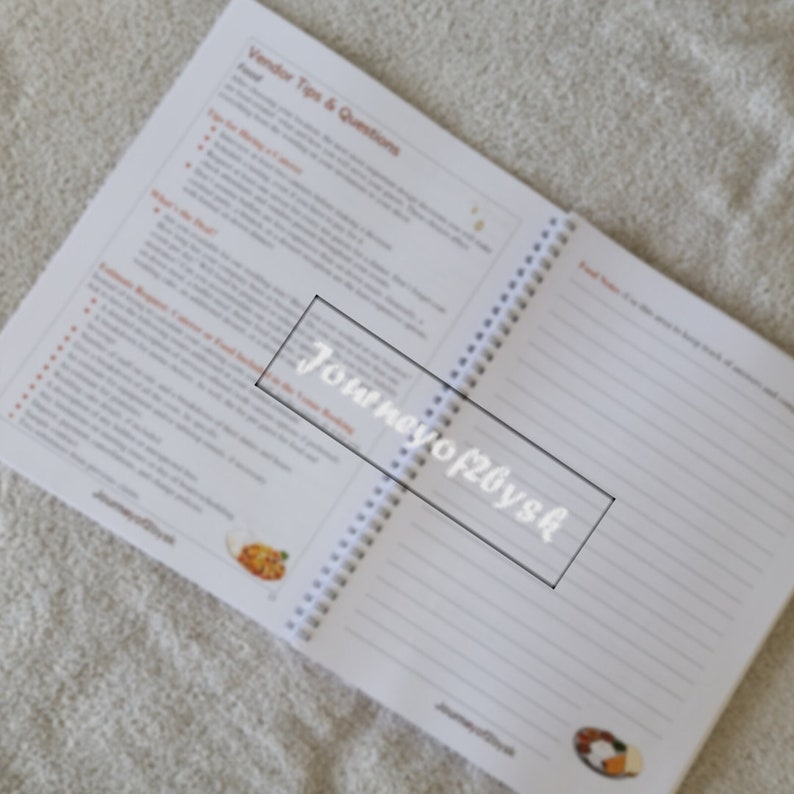 May include: An open spiral bound notebook with white pages and a white cover. The cover has the text "Journey of 20ys" printed in black.
