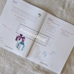 May include: A planner with a spiral binding, open to a page titled "Walima" with sections for "Music", "Walima Performances", and "Other". The page also features a small illustration of a musical note and a gift box with a purple ribbon.
