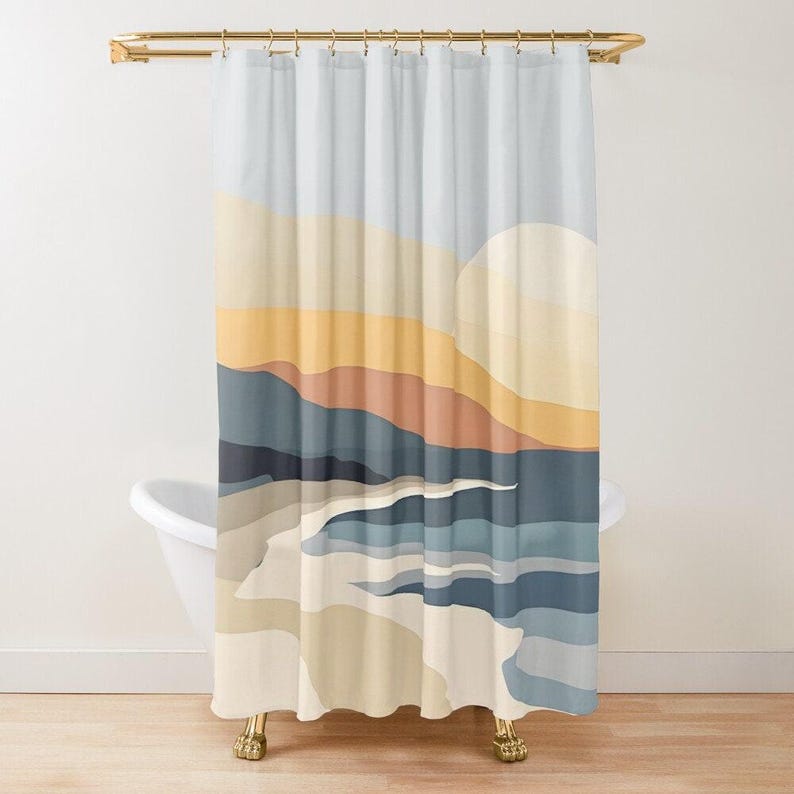 a shower curtain with an abstract beach scene design, sun, mountains and sea in soft colours