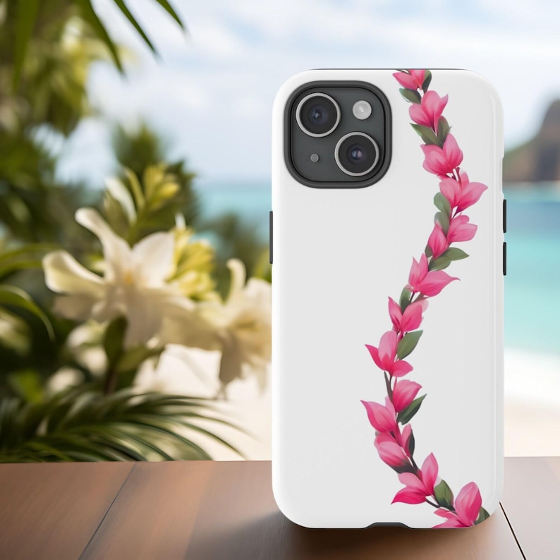 A white phone case with a Hawaiian flower lei floral design featuring pink flowers