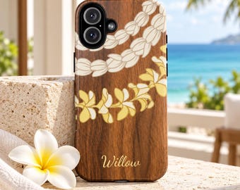 May include: A wood-grain phone case featuring a printed design of two layered floral leis, one in white and one in yellow, with the name Willow printed in a cursive script font near the bottom center of the case.