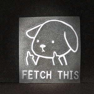 May include: White sticker with a cartoon dog giving the middle finger with the text "FETCH THIS" below.