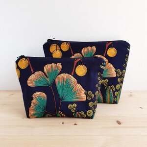 Makeup bag or toiletry bag with ginkgo and mimosa patterns on a navy blue background Water-repellent lining Handmade in France Medium