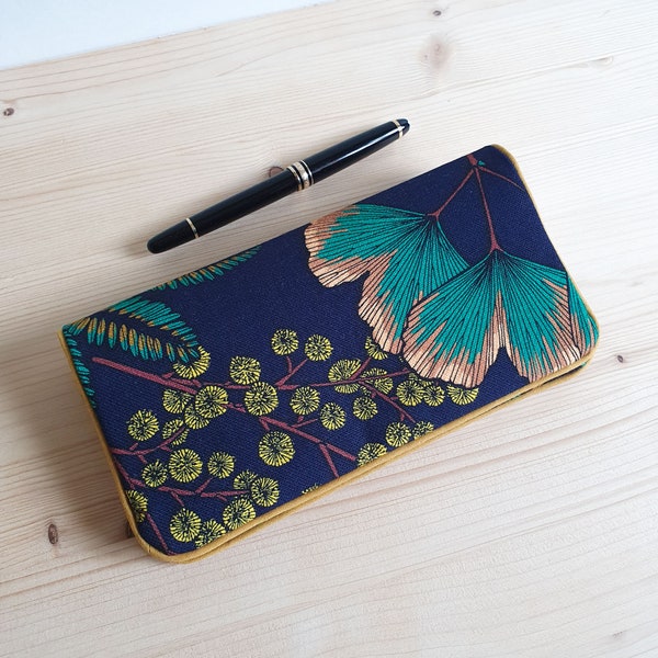 Checkbook holder, checkbook protector with ginkgo and mimosa patterns on a navy blue background