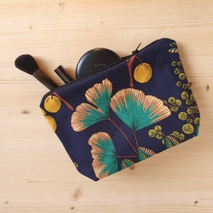 Makeup bag or toiletry bag with ginkgo and mimosa patterns on a navy blue background Water-repellent lining Handmade in France Small