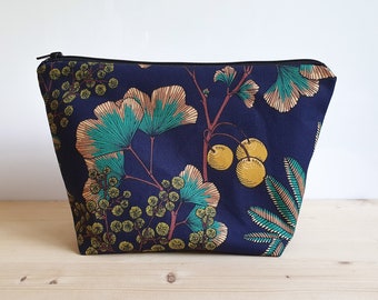 Large toiletry bag with ginkgo and mimosa patterns on a navy blue background - waterproof lining