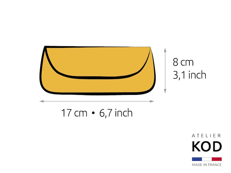 May include: A yellow envelope-style clutch bag with a curved flap and black outline. The dimensions are 17 cm by 8 cm, which is 6.7 inches by 3.1 inches. The image includes the text ATELIER KOD and MADE IN FRANCE with a French flag icon.