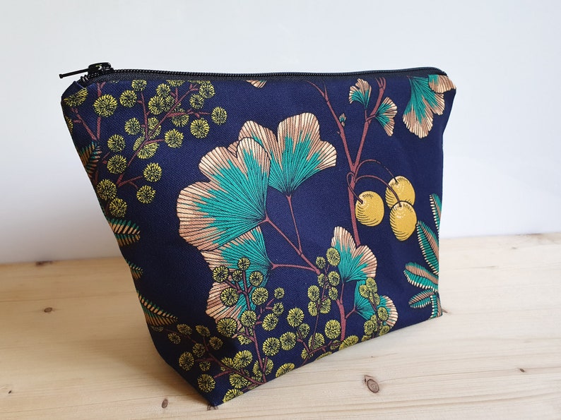 Large toiletry bag with ginkgo and mimosa patterns on a navy blue background waterproof lining image 3