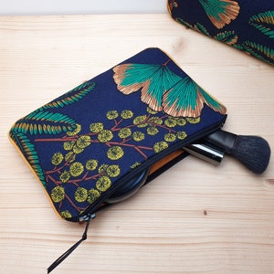 Fleece pouch - cotton makeup bag with ginkgo and mimosa patterns on a navy blue background