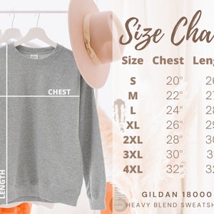 May include: Gray sweatshirt with a size chart showing chest and length measurements in inches. The chart includes sizes S through 4XL. The text "GILDAN 18000 HEAVY BLEND SWEATSHIRT" is at the bottom of the chart.