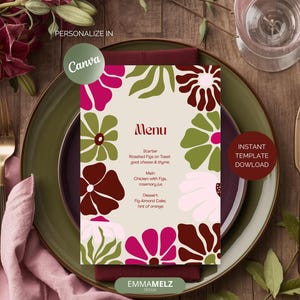 Op de afbeelding: Een bloemenmenukaart met een beige achtergrond, met een rand van gestileerde bloemen in bordeauxrood, roze en groen. Het menu bevat voorgerecht-, hoofdgerecht- en dessertopties. De woorden "Menu" en "Directe sjabloondownload" zijn zichtbaar.