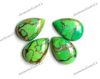 May include: Four pear-shaped gemstones with a vibrant green hue and intricate brown veining. The stones have a polished surface and are arranged on a white background. The gemstones are labeled with the text "Anemone GemsCo".