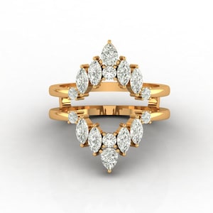 May include: A white ceramic mug with a black handle and the text "But First, Coffee" in a bold, black font. The mug is set against a blurred background, suggesting a cozy setting.