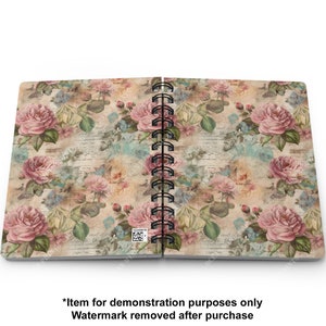 May include: A spiral bound notebook with a vintage floral design featuring pink roses and a faded background. The cover has a distressed look with a subtle text pattern.