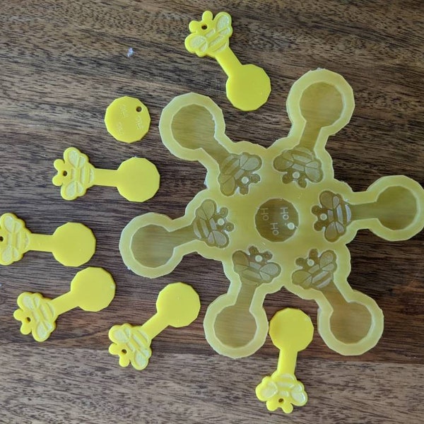 silicone mould of 7 trolley tokens bumble bees