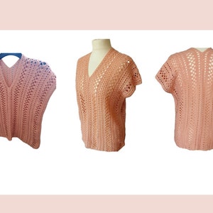 May include: A crocheted top with a V-neck and short sleeves. The top is made of a light pink yarn and has a delicate openwork pattern.