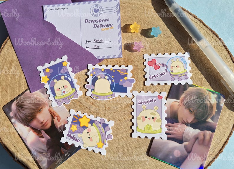 May include: A set of ten colorful stickers featuring cartoon aliens in spaceships. The stickers are shaped like postage stamps and have different phrases, including "Love ya", "Huggies", and "Mine".
