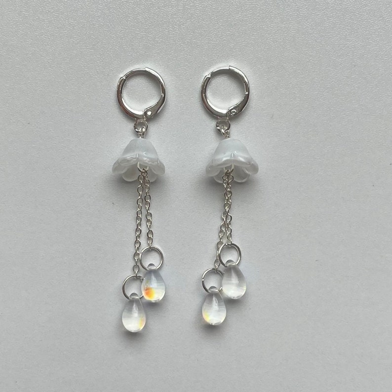 aquatic glass jellyfish dangling silver huggie hoop earrings White