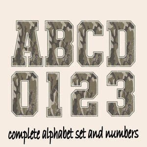 May include: A complete alphabet set and numbers, featuring the letters A, B, C, D and numbers 0, 1, 2, 3. The letters and numbers have a camouflage pattern in shades of green, brown, and tan, with a distressed, vintage look. The text "complete alphabet set and numbers" is below.