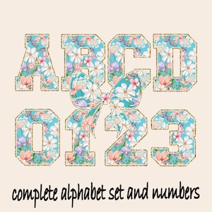 May include: Floral alphabet letters and numbers with a gold glitter outline. The letters A, B, C, and D, and numbers 0, 1, 2, and 3 are displayed. A large bow is in the center. The text "complete alphabet set and numbers" is at the bottom.