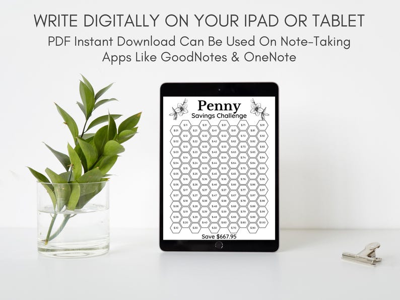 May include: A digital tablet displaying a printable penny savings challenge. The challenge is a honeycomb grid with numbers representing the amount to save each day. The text on the tablet reads "Penny Savings Challenge" and "Save $667.95".
