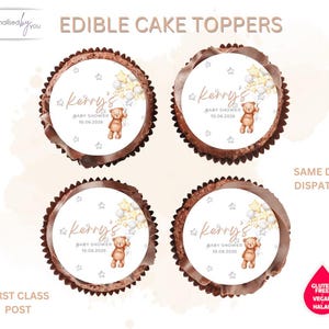 May include: Four edible cake toppers with a brown chocolate edge. Each topper has a white center with the text "Kerry's BABY SHOWER 10.06.2026" and a teddy bear illustration. The words "EDIBLE CAKE TOPPERS" are at the top.