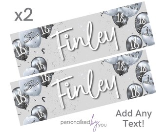 May include: Two silver and black banner decorations with a gray background. The banners feature a silver and black balloon pattern with the number 18 and the text "Happy Birthday". The banners also feature the name "Finley" in white cursive writing. The text "Add Any Text!" is at the bottom of the image.