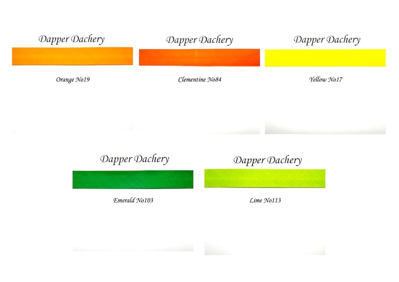 May include: Five color swatches of ribbon with the brand name "Dapper Dachery" and the color names and numbers: Orange No19, Clementine No84, Yellow No17, Emerald No103, and Lime No113.