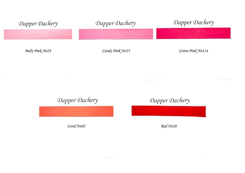 May include: Five swatches of Dapper Dachery fabric in different shades of pink and red. The swatches are labeled with the color name and number: Baby Pink No24, Candy Pink No25, Cerise Pink No114, Coral No83, and Red No28.