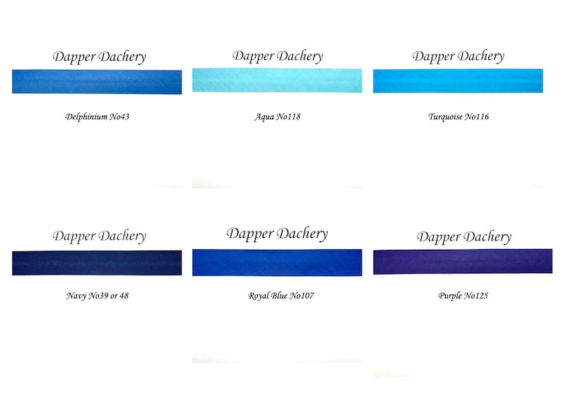 May include: Six ink samples in different shades of blue and purple, labeled with the brand name "Dapper Dachery" and the color name and number. The colors are Delphinium No43, Aqua No118, Turquoise No116, Navy No39 or 48, Royal Blue No107, and Purple No125.