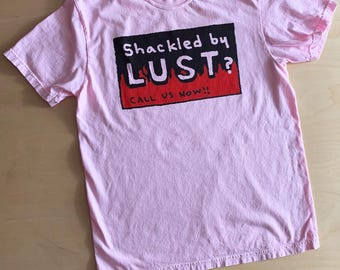 SHACKLED BY LUST? Call us now! religious billboard parody pink adult tee