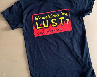 SHACKLED BY LUST? Call us now! religious billboard parody black adult tee