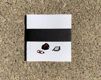 under/underpass small square accordion-folded zine/comic/artist book