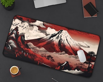 May include: A rectangular mouse pad featuring a Japanese-inspired landscape with a prominent red mountain, white clouds, and black accents. The design includes trees, birds, and a black border. A white mouse is on the pad.
