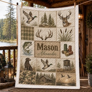 May include: A rectangular quilt featuring a patchwork design with outdoor themes including a mallard duck, deer, fish, hunting dog, cabin, and shotgun shells. The center panel displays the names Mason and Alexander in brown text.