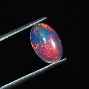 Pietra portafortuna di ottobre di forma ovale, cabochon di opale di fuoco multiplo, cabochon di opale etiope naturale, pietra preziosa sciolta, dimensioni 10X7X3 MM Ct.1.40 Gioielli